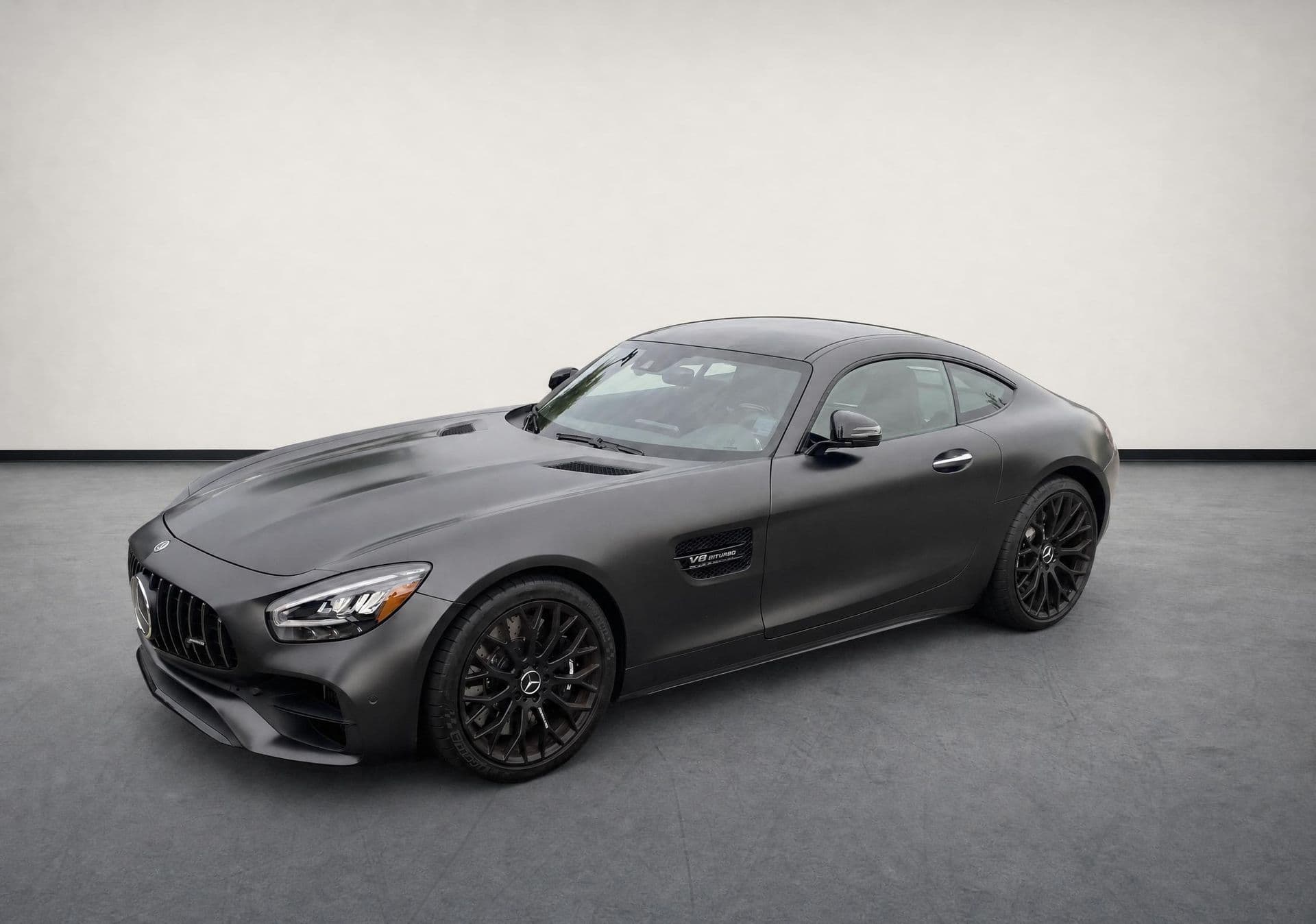 A car photographed outdoors next to the same car on a clean studio-style background.
